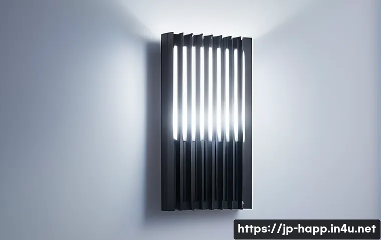 LED 조명의 수명 연장법 - A modern LED lighting fixture with an aluminum heat sink, installed on a wall with visible air gaps ...